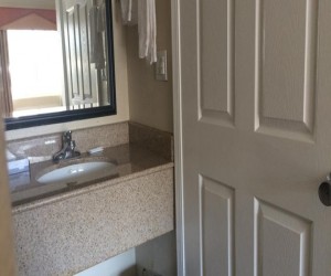 Bathroom vanity in Travel Inn SF guest room
